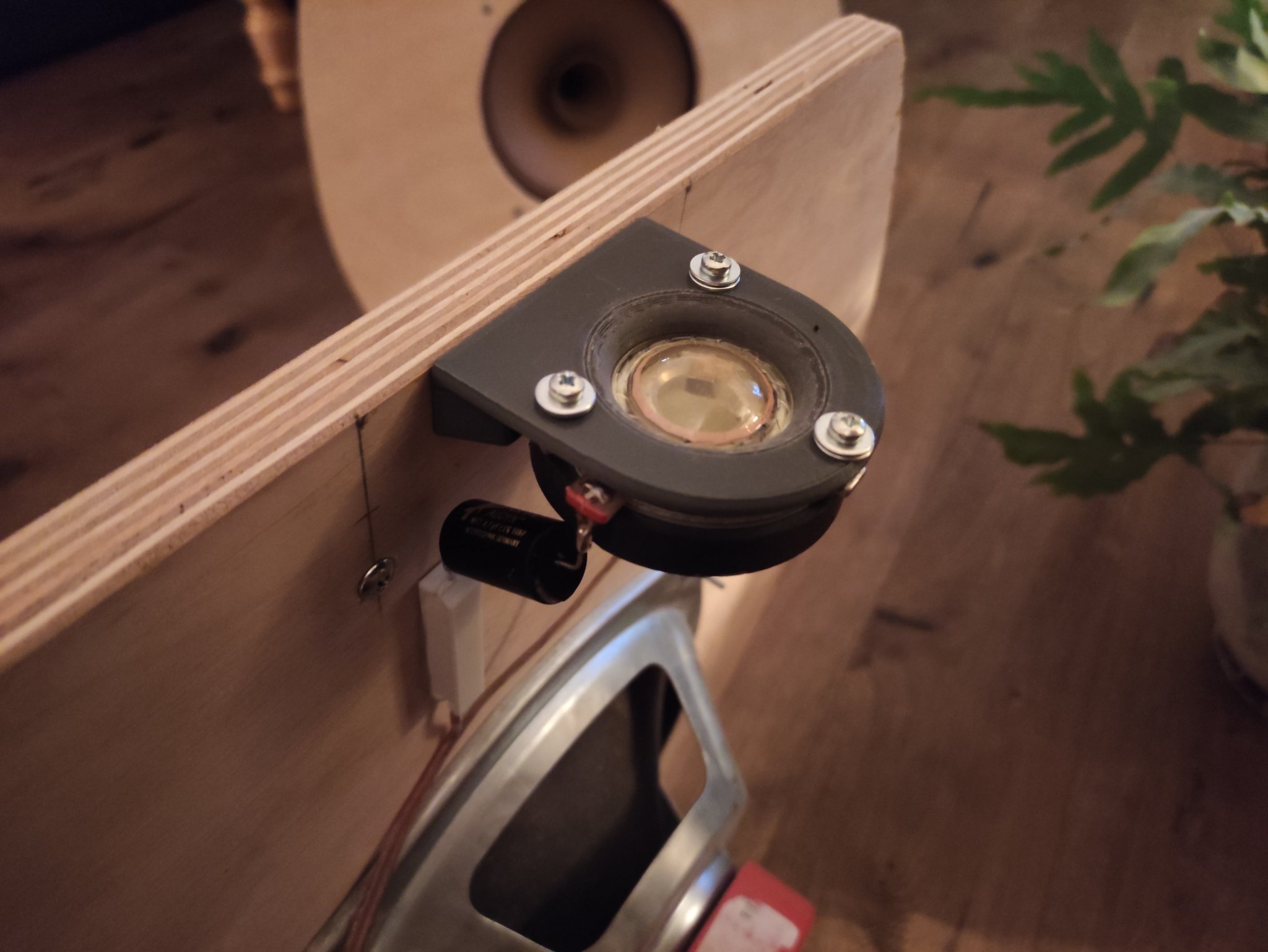 The tweeter has been mounted to the rear of the speaker, in an upwards direction.