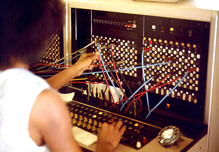 Telecom_switchboard_and_operator.jpg