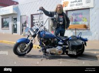 hippie-biker-with-his-customised-motorcycle-in-sylvan-lake-alberta-ATWJ3C.jpg
