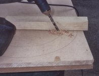 drilling pilot hole for saw.jpg