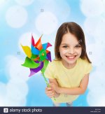 smiling-child-with-colorful-windmill-toy-EEXTYN.jpg