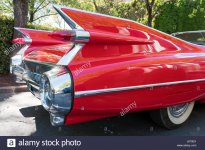 detail-photograph-of-the-tail-fins-on-a-vintage-red-cadillac-convertible-J670EX.jpg